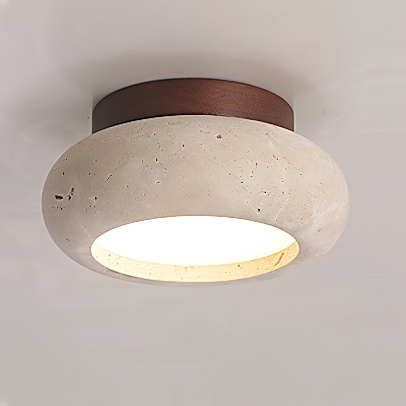 Ceiling light fixture with concrete-like finish and wooden accent on a neutral background